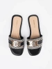 Black and white women's slides with a gold chain