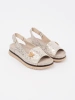 Light beige platform sandals with a pin