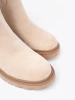 Modern light beige ankle boots in a simple style