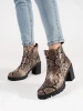 Heeled ankle boots in snake print