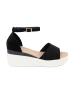 Black women's sandals on a white wedge