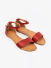 Red flat sandals with covered heel