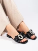 Black slip-on sandals with a bow