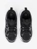 Black sneakers with breathable upper and chunky white sole