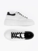 White sneakers with black inserts