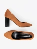 Light brown pumps on a black column heel