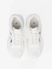 White sports shoes with a decorative accent