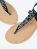 Black flat thong sandals