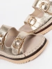 Golden sandals with gold accents