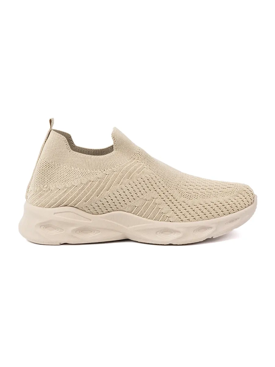 Light beige slip-on shoes made of breathable material