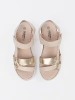 Beige platform sandals with metallic embellishment