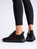 Women's black sports shoes with black soles