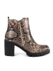 Heeled ankle boots in snake print