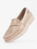 Beige perforated loafers with a gold detail