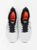 White and black sports shoes with an orange detail