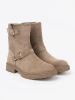 Beige suede ankle boots with decorative buckles