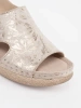 Light beige flat sandals with a buckle