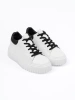 White sneakers with black inserts